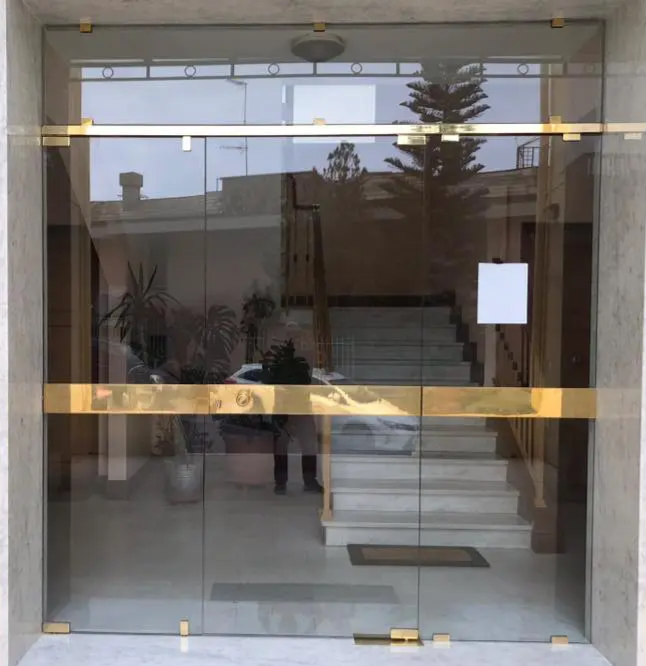 Porta ingresso condominio vetro temperato Milano